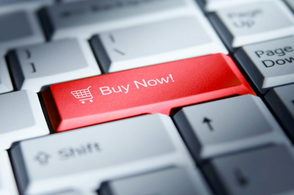 Keyboard-with-red-"Buy-Now!"-shopping-cart-key,-pressed-e-commerce-purchase-button.