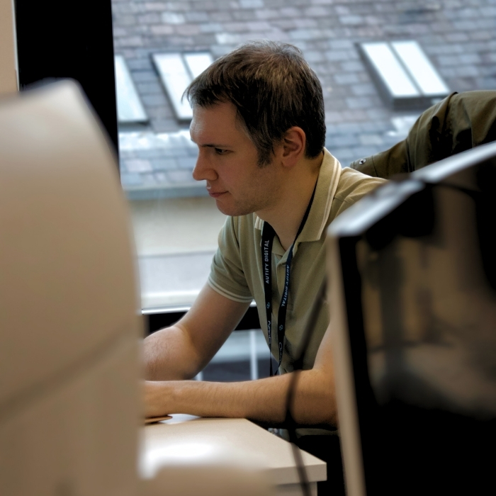 Person typing at a desk