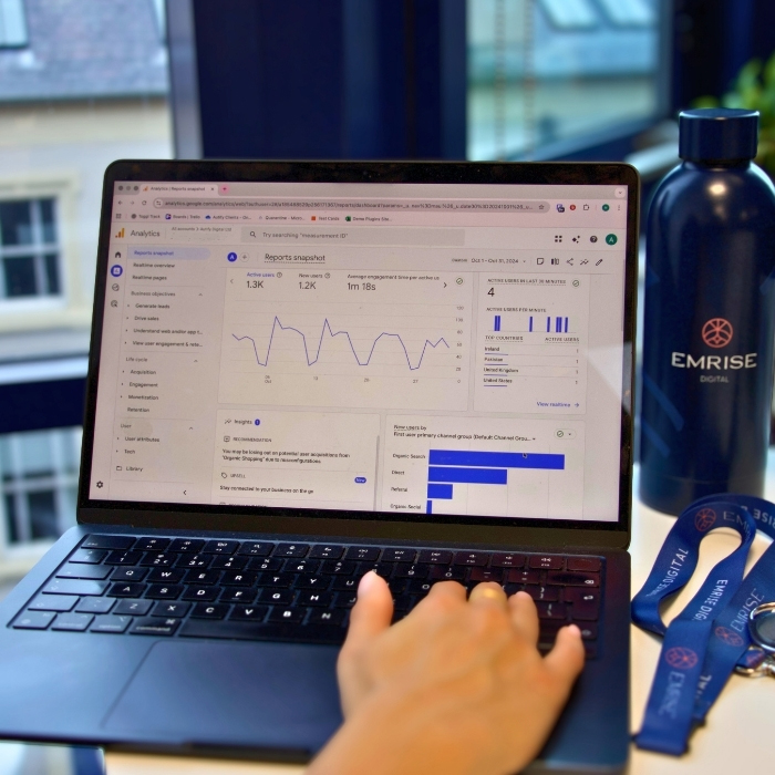 Laptop screen with graphs showing