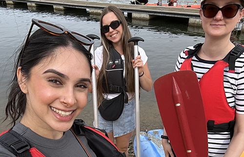 Emrise team with a kayak