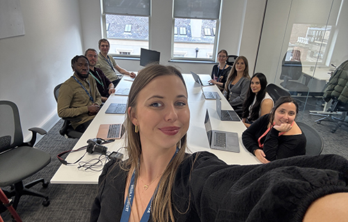 Emrise team at a desk