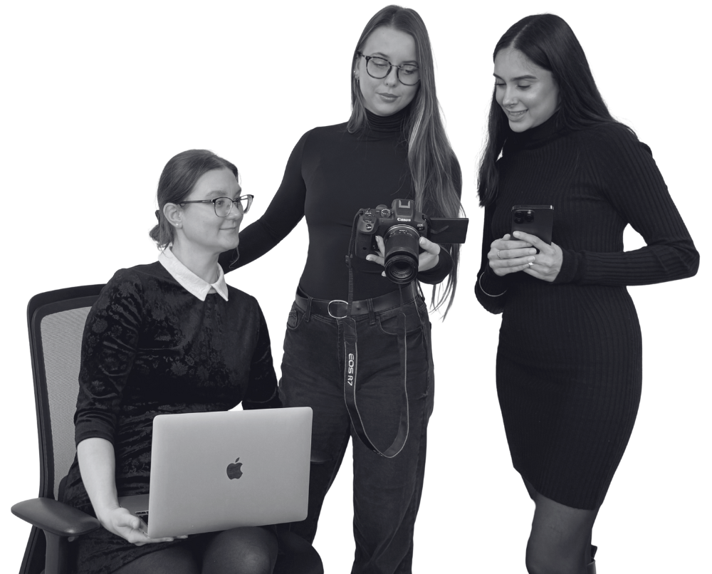 Emrise-team-members-with-laptop,-camera-and-phone