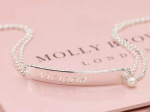 Engraved-silver-bracelet-on-pink-background